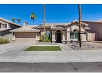 Charming single-story home featuring manicured landscaping and a tile roof at 16250 S 13Th St, Phoenix, AZ 85048
