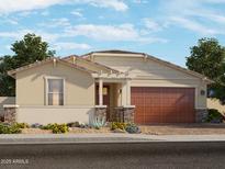 Charming single-story home featuring a landscaped front yard and attached two-car garage at 17828 W Pierson St, Goodyear, AZ 85395