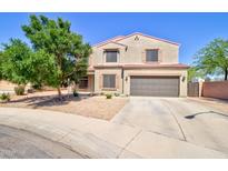 Charming two-story home with a well-manicured front yard and neutral color palette in a suburban neighborhood at 2008 N Pablo Ct, Casa Grande, AZ 85122