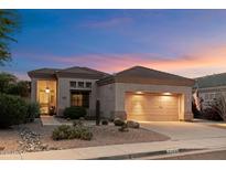 Charming single-story home with desert landscaping and a two-car garage at 22432 N 52Nd Pl, Phoenix, AZ 85054