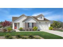 Charming single-Gathering home with white siding, brick accents, manicured lawn and a two car garage at 3604 W Horse Trail Way, San Tan Valley, AZ 85144