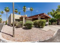 Charming home exterior boasts a covered carport and lush landscaping at 515 S Saguaro Way, Mesa, AZ 85208