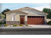 Charming single-story home with a stone accent and a welcoming front yard with desert landscaping at 5480 S 246Th Ln, Buckeye, AZ 85326