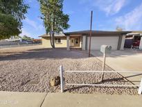 Charming single-story home with a well-kept rock yard and a two-car garage at 1105 W Anderson Dr, Phoenix, AZ 85023