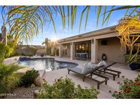 Inviting backyard oasis with a private pool and sun loungers, perfect for relaxation and entertaining at 14518 N 99Th St, Scottsdale, AZ 85260