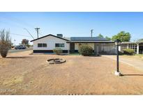 Charming single-Gathering home featuring a well-maintained lawn and a welcoming front porch, perfect for relaxed living at 2204 E Birchwood Ave, Mesa, AZ 85204
