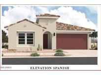 Charming Spanish-style home featuring a red tile roof and a two-car garage at 36860 W Santa Maria St St, Maricopa, AZ 85138