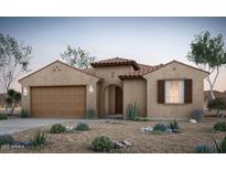 Charming single-story home featuring desert landscaping, a tile roof, and a two-car garage at 42980 W Palo Abeto Dr, Maricopa, AZ 85138