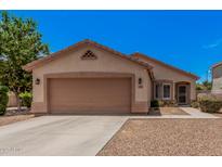 Charming single-story home featuring a two-car garage and well-maintained landscaping at 1282 N Banning St, Gilbert, AZ 85234