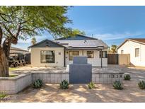 Charming home featuring solar panels, a landscaped yard, and a modern desert vibe at 1338 E Granada Rd, Phoenix, AZ 85006