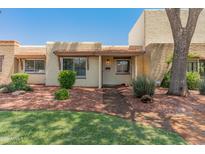 Charming single-story home with a brick walkway, mature landscaping, and a freshly manicured green lawn at 1808 W Rose Ln, Phoenix, AZ 85015