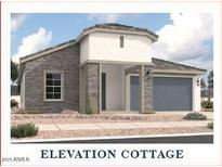 Charming cottage-style home featuring stone accents, a covered entry, and a two-car garage at 36907 W Santa Maria St, Maricopa, AZ 85138