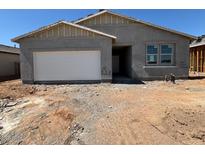 A single story home with a two car garage is shown at 46868 W Old Timer Rd, Maricopa, AZ 85139