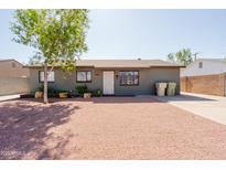 Charming single-story home with gravel front yard and mature landscaping at 5637 N 63Rd Dr, Glendale, AZ 85301