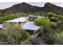 View of the exterior elevation showcasing a unique design and well-kept surrounding landscape at 6306 N Camelback Manor Dr, Paradise Valley, AZ 85253