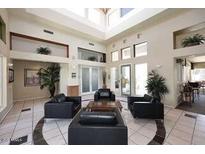 The spacious lobby area is brightly lit with comfortable seating and stylish decor at 11375 E Sahuaro Dr # 2064, Scottsdale, AZ 85259