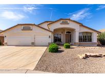 Charming single-story home with a well-manicured gravel yard and a spacious three-car garage at 2230 E Whitten St, Chandler, AZ 85225