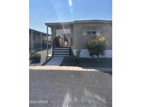 Charming single-story home features well-maintained landscaping and welcoming entryway, complete with a quaint front yard at 300 S Val Vista Dr # 51, Mesa, AZ 85204
