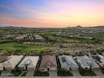 Stunning aerial view of desert homes, with golf course and mountain views at 31210 N 122Nd Ln, Peoria, AZ 85383