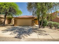 Charming single-story home with a well-maintained front yard and a two-car garage at 5125 E Juana Ct, Cave Creek, AZ 85331