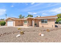 Single-story home featuring a desert-scape front yard, covered entry, and attached garage, located in a sunny locale at 636 S Rosemont --, Mesa, AZ 85206