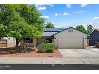 Charming single-story home featuring a two-car garage, solar panels, and low-maintenance landscaping at 8540 W Ocotillo Rd, Glendale, AZ 85305