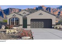 New construction home featuring a two-car garage, desert landscaping, and beautiful mountain views at 10622 W Bloch Rd, Tolleson, AZ 85353