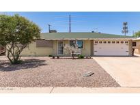 Charming single-story home featuring low-maintenance desert landscaping and a one-car garage at 1308 N 66Th St, Scottsdale, AZ 85257