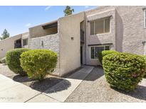 Charming condo featuring well-maintained landscaping and updated exterior paint, in a desirable community at 1927 E Hampton Ave # 204, Mesa, AZ 85204