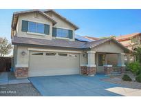 Charming two-story home featuring a spacious garage, well-maintained landscaping, and a welcoming front porch at 20722 N 38Th St, Phoenix, AZ 85050