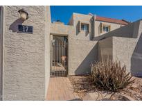 Charming home entrance with private gate and well-maintained landscaping at 2524 S El Paradiso -- # 17, Mesa, AZ 85202