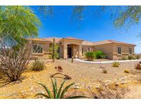 Stunning desert landscaping accents the home's front yard, offering curb appeal and low maintenance at 3614 W Phillips Rd, San Tan Valley, AZ 85144
