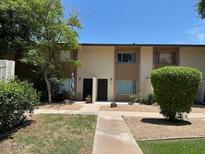 Complex of townhomes with tidy landscaping and neutral-colored exteriors and walkways at 4701 N 68Th St # 105, Scottsdale, AZ 85251