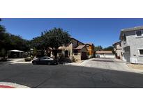 Charming multi-story townhouse with a well maintained exterior and community play area at 876 S Colonial Dr, Gilbert, AZ 85296