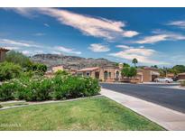 Charming, light terracotta home with mountain views, lush foliage and a beautiful blue sky at 10655 N 9Th St # 112, Phoenix, AZ 85020