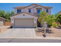 Charming two-story home featuring a spacious two-car garage and a well-maintained front yard at 3047 S Mandy St, Mesa, AZ 85212