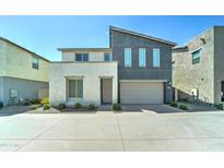 Charming two-story home with a two-car garage and low-maintenance landscaping at 4927 S Tune --, Mesa, AZ 85212