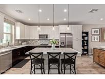 Stylish kitchen features a large island with seating and stainless steel appliances at 820 N 8Th Ave # 14, Phoenix, AZ 85007