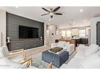 Comfortable living area featuring a large TV, plush seating, and stylish decor at 820 N 8Th Ave # 14, Phoenix, AZ 85007
