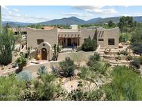 Attractive Southwestern-style home with desert landscaping, private courtyard, and mountain views at 9030 E Trail Dr, Carefree, AZ 85377