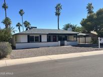 Charming single-story home with desert landscaping and a cozy front porch at 1309 E Julie Dr, Tempe, AZ 85283
