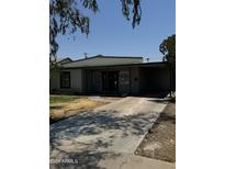 Charming single-story home featuring a covered entry, a carport, and a private driveway at 2045 E Orange St, Tempe, AZ 85281