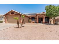 Charming single-story home with desert landscaping and a welcoming front entrance at 2541 N 86Th Ave, Phoenix, AZ 85037
