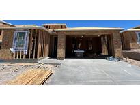 New home construction shows framing stage with garage and WaterBlock wrap at 27358 N 69Th Dr, Peoria, AZ 85383
