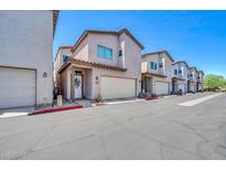 Inviting two-story townhome showcasing a private garage and well-maintained landscaping at 3034 N 39Th St # 12, Phoenix, AZ 85018