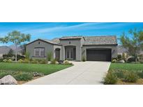 Charming single-story home featuring a well-manicured front lawn, neutral color palette, and a two-car garage at 3363 W Sunstone Dr, San Tan Valley, AZ 85144