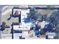 An aerial view of the property shows a sparkling pool and landscaped backyard at 6329 E Voltaire Ave, Scottsdale, AZ 85254