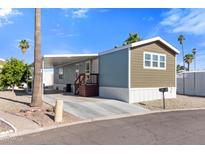 Charming single-story home with covered parking and low-maintenance desert landscaping at 701 S Dobson Rd # 447, Mesa, AZ 85202