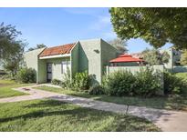 Charming single-story home with landscaped front yard and red tiled roof detail at 735 E Cochise Dr, Phoenix, AZ 85020