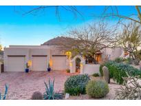 Charming home with desert landscaping, brick driveway, three car garage, and mountain views at 24724 N 119Th Pl, Scottsdale, AZ 85255